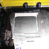 A CPU installed in its motherboard socket, overlaid with a translucent shell script for enabling ZFS auto-snapshots.