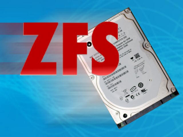 Bold red “ZFS” text overlaid on a tilted laptop hard disk drive against a bright blue background.