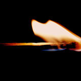 A burning matchstick